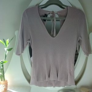 Sexy open back peplum sweater